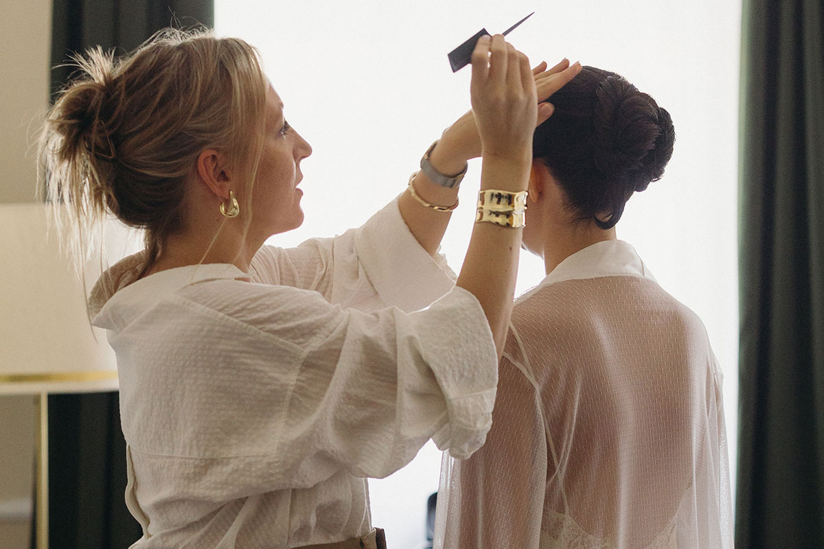 Precise bridal hairstyling focused on natural movement, texture and secure hold.